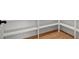 A walk-in pantry with hardwood floors, white trim, and white shelving provides storage at 125 Drummond Pl, Covington, GA 30014