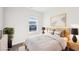 Cozy bedroom with neutral tones, a comfortable bed, and natural light from the window at 434 Herring Dr, Acworth, GA 30102