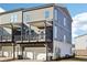 Modern townhome featuring gray siding, a one-car garage, and a private balcony for outdoor living at 434 Herring Dr, Acworth, GA 30102