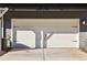 Two car garage door of house number 434 has a clean look with new gray paint and contrasting hardware at 434 Herring Dr, Acworth, GA 30102
