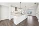 Stylish kitchen with quartz countertops, stainless steel appliances, and a view into the living room at 434 Herring Dr, Acworth, GA 30102
