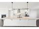 Stylish kitchen with quartz countertops, stainless steel appliances, and a view into the living room at 434 Herring Dr, Acworth, GA 30102