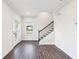 Living room featuring hardwood floors, staircase with decorative spindles, and natural light at 434 Herring Dr, Acworth, GA 30102