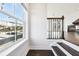 Bright staircase with wood floors, iron railings, leading into the living area with a cozy fireplace at 434 Herring Dr, Acworth, GA 30102