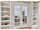 Built-in bookshelves flank a glass French door leading to the living room at 487 Burlington Ne Rd, Atlanta, GA 30307