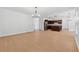 Bright dining area with hardwood floors and modern chandelier at 7431 Saint David St, Fairburn, GA 30213