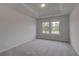 Well-lit bedroom with scenic view through double windows at 157 Haverling Pass, Hampton, GA 30228