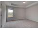 Bright bedroom with large window and neutral carpet flooring at 157 Haverling Pass, Hampton, GA 30228