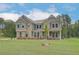 Well-designed two-story home with a large front yard and neutral color palette at 157 Haverling Pass, Hampton, GA 30228