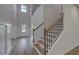 Grand entryway with hardwood floors, a staircase with iron spindles, and high ceilings at 157 Haverling Pass, Hampton, GA 30228