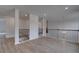Open loft area with railing and durable flooring provides a versatile living space at 157 Haverling Pass, Hampton, GA 30228