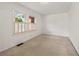 This bedroom has neutral carpet, white walls, and natural light through shuttered windows at 318 Stewart Nw Ave, Marietta, GA 30064