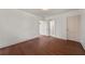 Bedroom featuring hardwood floors, white walls, with a view into another room at 318 Stewart Nw Ave, Marietta, GA 30064