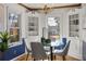 Bright dining area with built-in hutch and glass dining table at 318 Stewart Nw Ave, Marietta, GA 30064