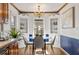 Charming dining area with built-in cabinets and a glass table at 318 Stewart Nw Ave, Marietta, GA 30064