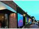 Building exterior featuring colorful mural with black trim, brick, and green awning at 318 Stewart Nw Ave, Marietta, GA 30064