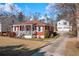 View of the house showing the long driveway and detached garage at 318 Stewart Nw Ave, Marietta, GA 30064