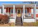 Inviting front porch with steps leading to the entrance of the home at 318 Stewart Nw Ave, Marietta, GA 30064