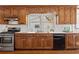 Well-lit kitchen featuring wood cabinets, stainless steel appliances, and a bright window over the sink at 318 Stewart Nw Ave, Marietta, GA 30064