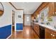 Functional kitchen with wood cabinetry, stainless steel appliances, and a view into the adjacent dining area at 318 Stewart Nw Ave, Marietta, GA 30064