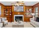 Cozy living room features wood paneling, fireplace with decorative shelving, and comfortable seating at 318 Stewart Nw Ave, Marietta, GA 30064