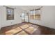 Living room with hardwood floors and two windows at 318 Stewart Nw Ave, Marietta, GA 30064