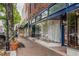 Charming street view of the Georgia Metropolitan Dance Theatre and a brick-paved sidewalk lined with trees and shops at 318 Stewart Nw Ave, Marietta, GA 30064