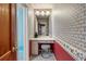 Small vanity area with mirror and a grey stool at 318 Stewart Nw Ave, Marietta, GA 30064