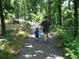 Father and son walking along a tree-lined path at 318 Stewart Nw Ave, Marietta, GA 30064