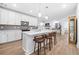 Modern kitchen featuring a spacious island with quartz countertop and pendant lighting at 3211 Orwell Way # 4302, Cumming, GA 30041