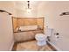 Bathroom featuring a soaking tub and a toilet with neutral colored tiles on the wall at 1409 Oakridge Cir, Decatur, GA 30033