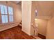 Staircase with hardwood floor, staircase with carpet, and a window at 1409 Oakridge Cir, Decatur, GA 30033