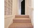 Carpeted staircase with a window that has decorative glass blocks at 1409 Oakridge Cir, Decatur, GA 30033