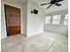 Bright sun room featuring tiled floor, wainscoting, and several windows to let in natural light at 1409 Oakridge Cir, Decatur, GA 30033