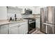 Well-equipped kitchen, stainless steel appliances and white subway tile at 2479 Peachtree Ne Rd # 612, Atlanta, GA 30305