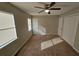 A bedroom featuring neutral paint, carpet, a ceiling fan, and a window for natural light at 926 Westland Dr, Marietta, GA 30064
