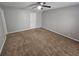 Bedroom with neutral walls and carpet, ceiling fan and a white door at 926 Westland Dr, Marietta, GA 30064