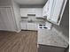Updated kitchen with white cabinets, granite countertops, and modern appliances at 926 Westland Dr, Marietta, GA 30064