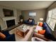 Cozy living room with fireplace, plush rug, and comfortable seating arrangement at 926 Westland Dr, Marietta, GA 30064