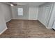 Open floor plan living room with wood flooring and access to outdoor sliding doors at 926 Westland Dr, Marietta, GA 30064