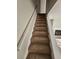 Carpeted stairway featuring white handrails leading up to the next level of the home at 926 Westland Dr, Marietta, GA 30064