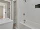 Well-lit bathroom features a tub with white subway tile surround and decorative tile flooring at 5380 Saint Lo Ln, Atlanta, GA 30349