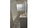 Updated bathroom with subway tile shower and patterned floor at 5380 Saint Lo Ln, Atlanta, GA 30349