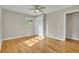 Inviting bedroom with hardwood floors, closet, and a window offering scenic views at 5380 Saint Lo Ln, Atlanta, GA 30349