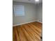 Bright bedroom with hardwood floors and ceiling fan at 5380 Saint Lo Ln, Atlanta, GA 30349