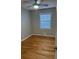 Bedroom with hardwood floors and a ceiling fan at 5380 Saint Lo Ln, Atlanta, GA 30349