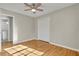 Bedroom with hardwood floors, closet space, and bathroom access, providing a functional layout at 5380 Saint Lo Ln, Atlanta, GA 30349