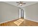 Bedroom exhibiting hardwood floors, neutral walls, and a ceiling fan, offering a cozy atmosphere at 5380 Saint Lo Ln, Atlanta, GA 30349