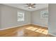 Comfortable bedroom with wood floors and bright, airy windows at 5380 Saint Lo Ln, Atlanta, GA 30349