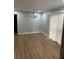 Bright dining room with hardwood floors and modern chandelier at 5380 Saint Lo Ln, Atlanta, GA 30349